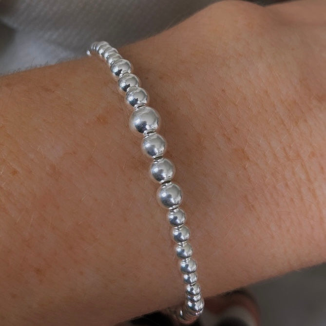 Pulsera bolitas degradé plata