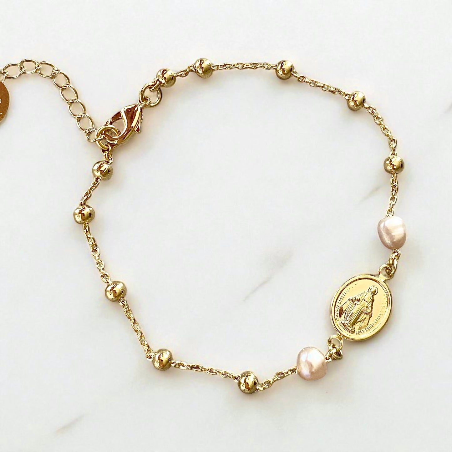 Pulsera bolitas perlas virgen oro
