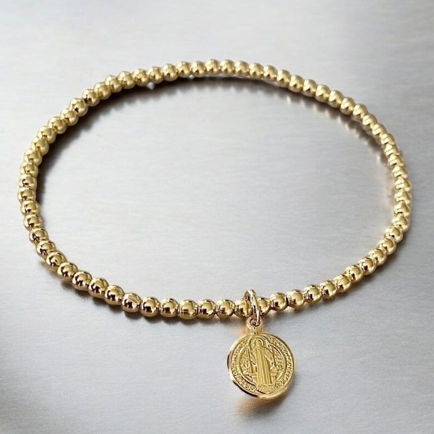 Pulsera bolitas san Benito oro