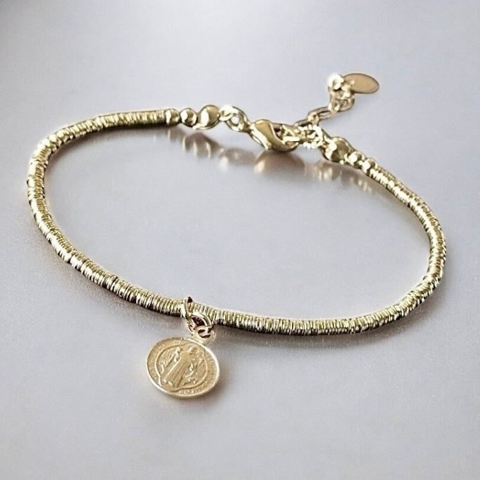 Pulsera mostacillas san benito oro