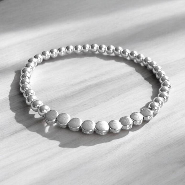 Pulsera bolitas planas plata
