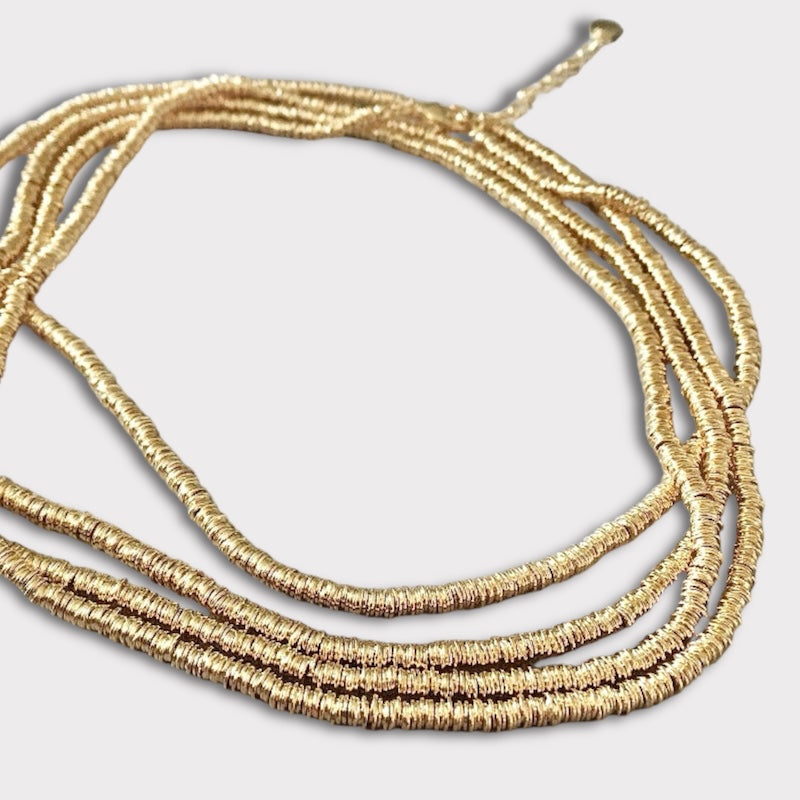 Collar mostacillas argollitas 125 cm. oro