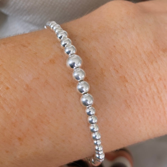 Pulsera bolitas degradé plata