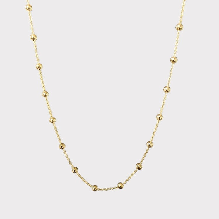 Collar bolitas oro