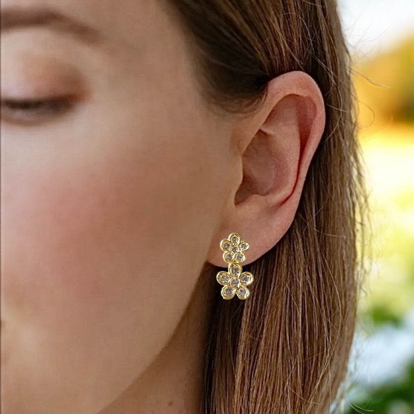 Aros doble flor circones oro