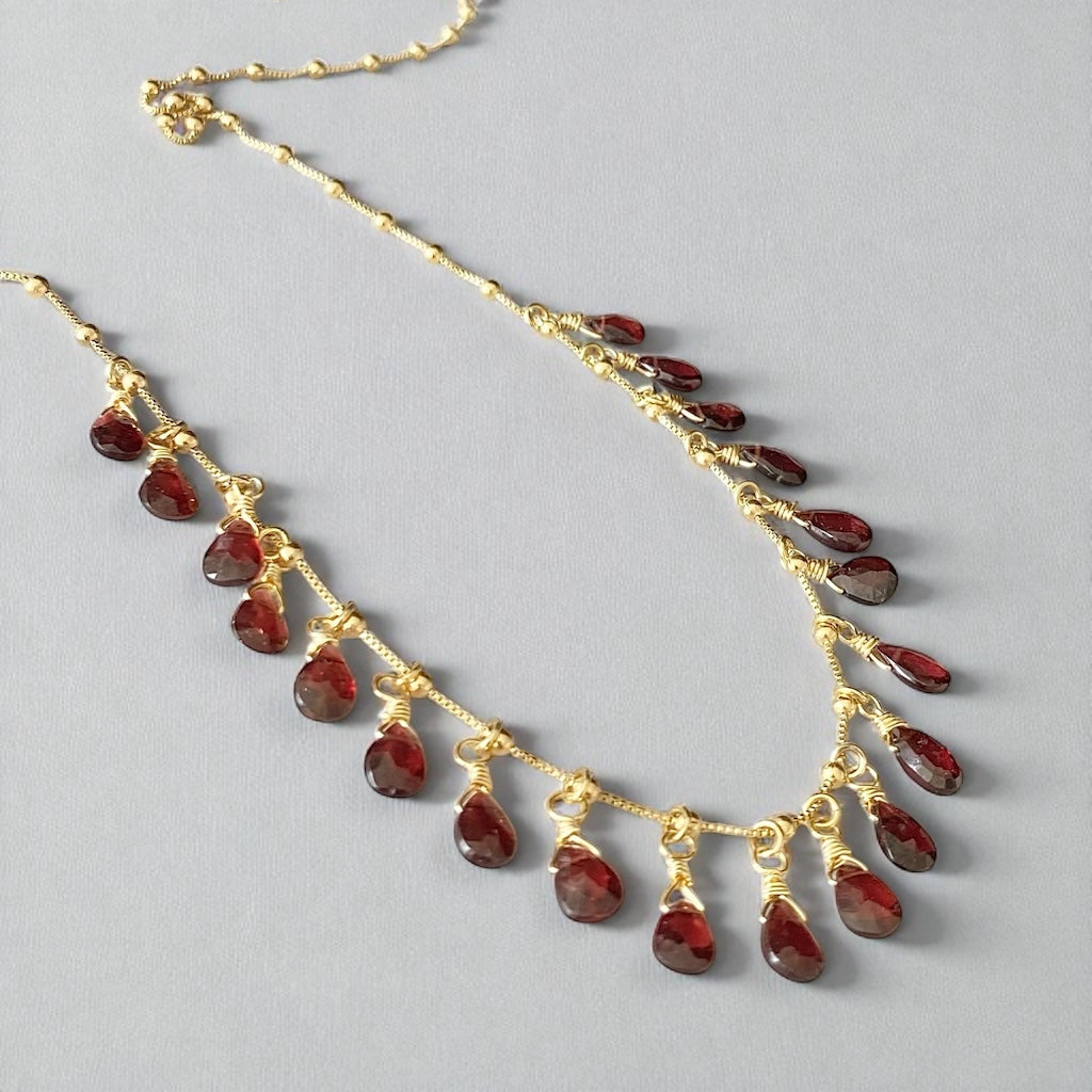 Collar granate oro