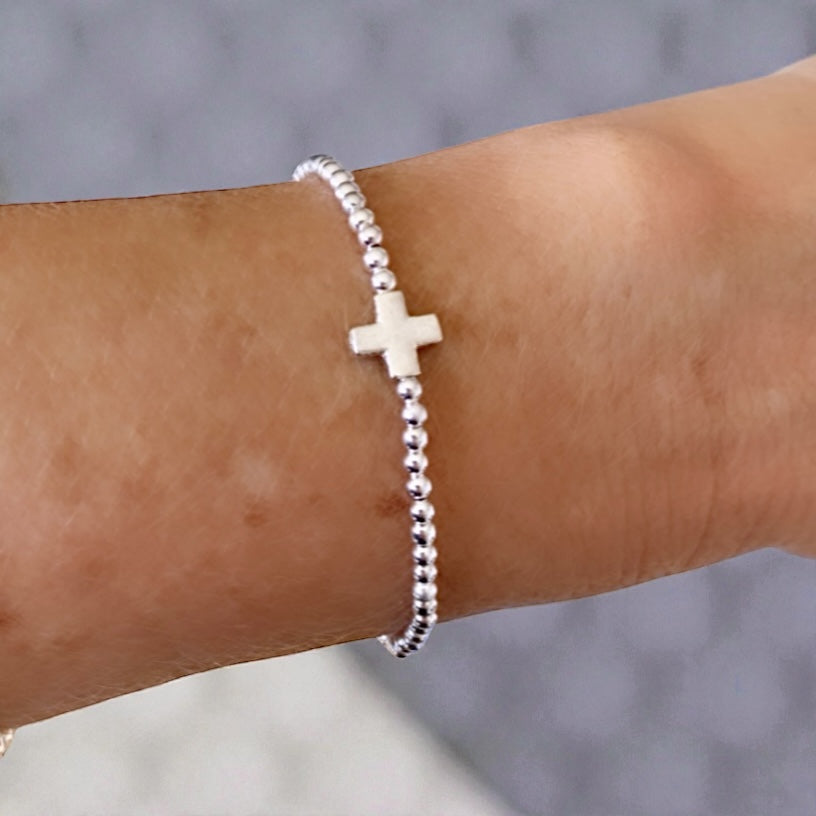 Pulsera bolitas cruz plata