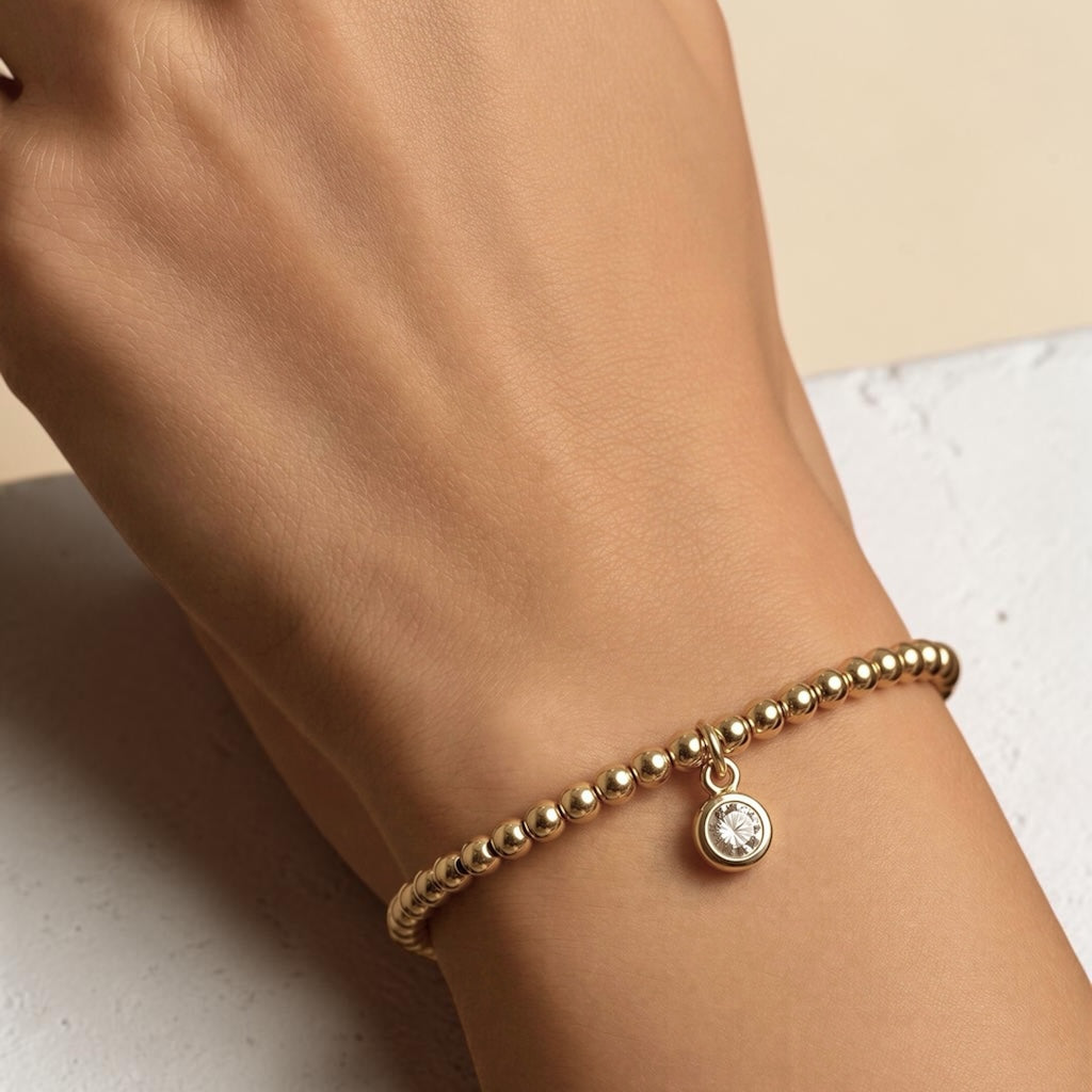 Pulsera bolitas punto de luz oro