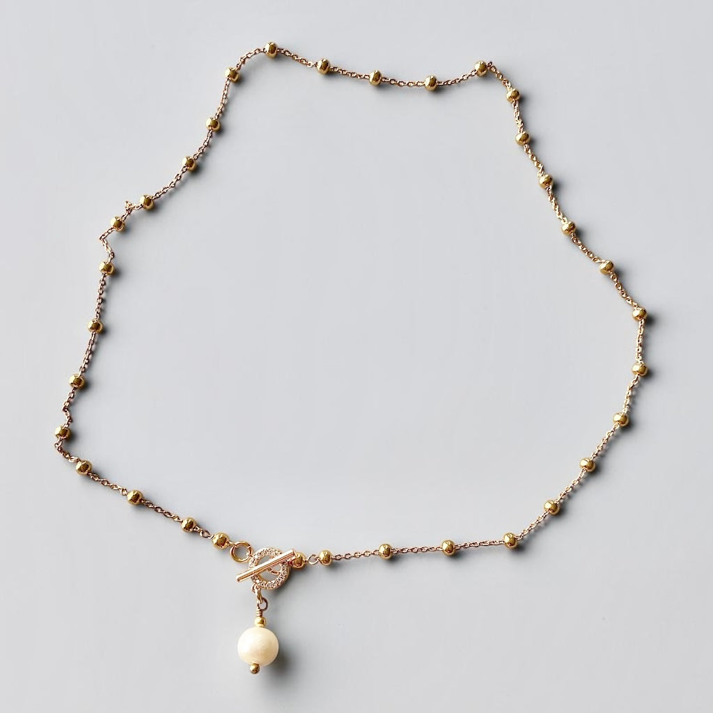Collar bolitas perla broche oro