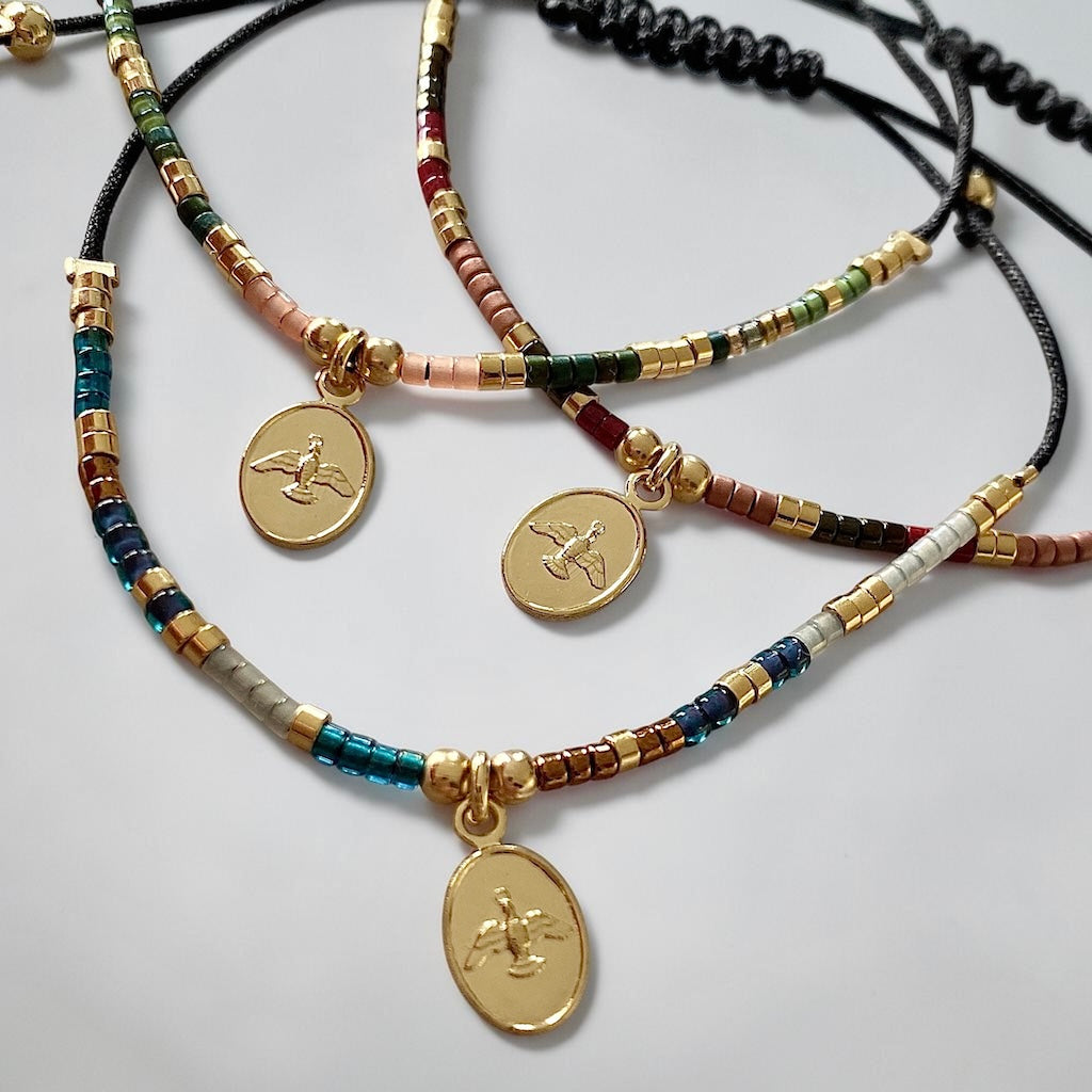 Pulsera hilo mijuki Espíritu Santo oro
