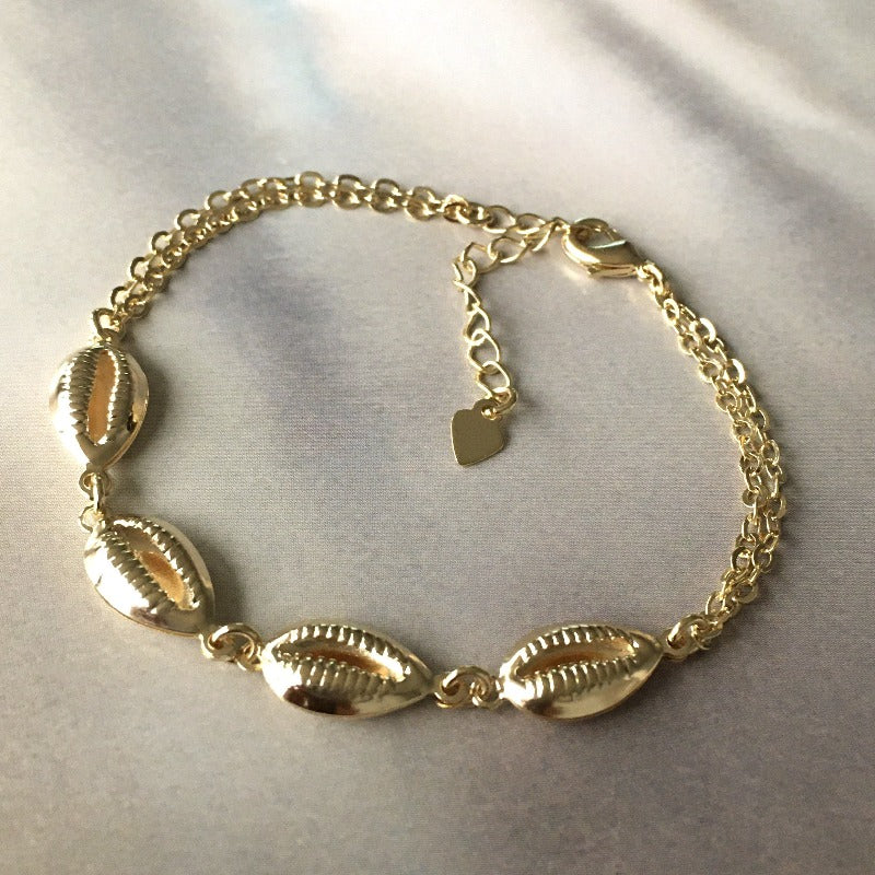 pulsera conchitas oro