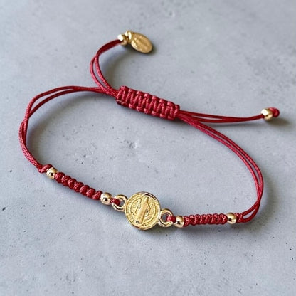 Pulsera hilo San Benito oro