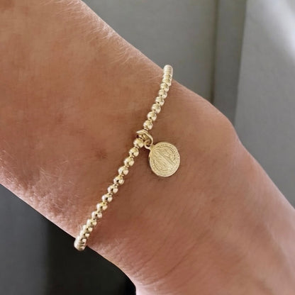 Pulsera bolitas san Benito oro