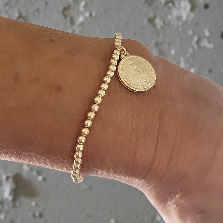 Pulsera bolitas medalla oro