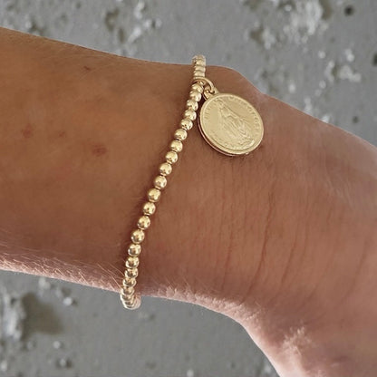 Pulsera bolitas medalla oro