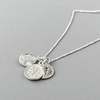 Collar trío hojita cruz plata 925