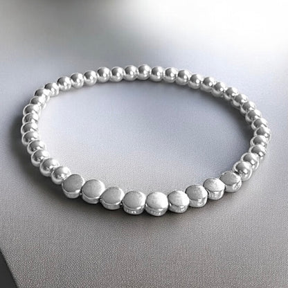 Pulsera bolitas planas plata