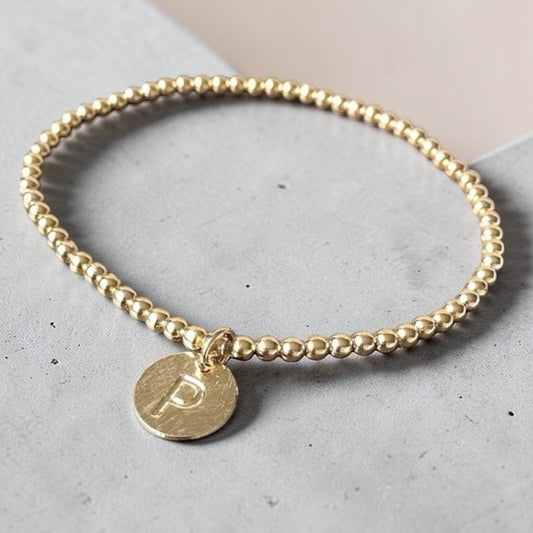 Pulsera letra oro