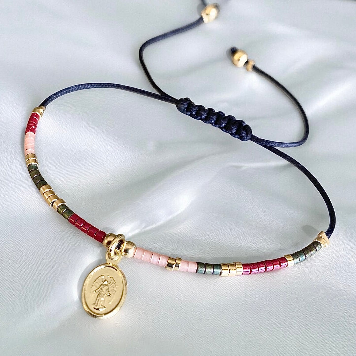 Pulsera hilo mijuki arcángel oro
