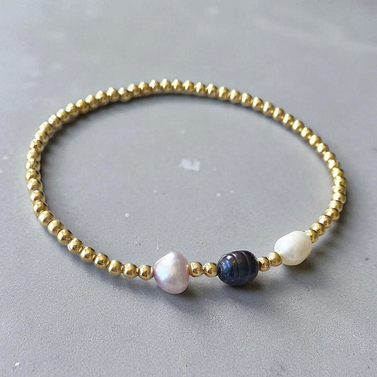 Pulsera tres perlas de río oro