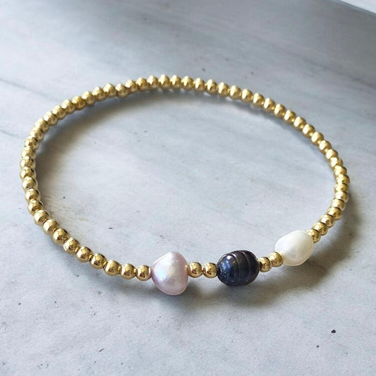 Pulsera tres perlas de río oro