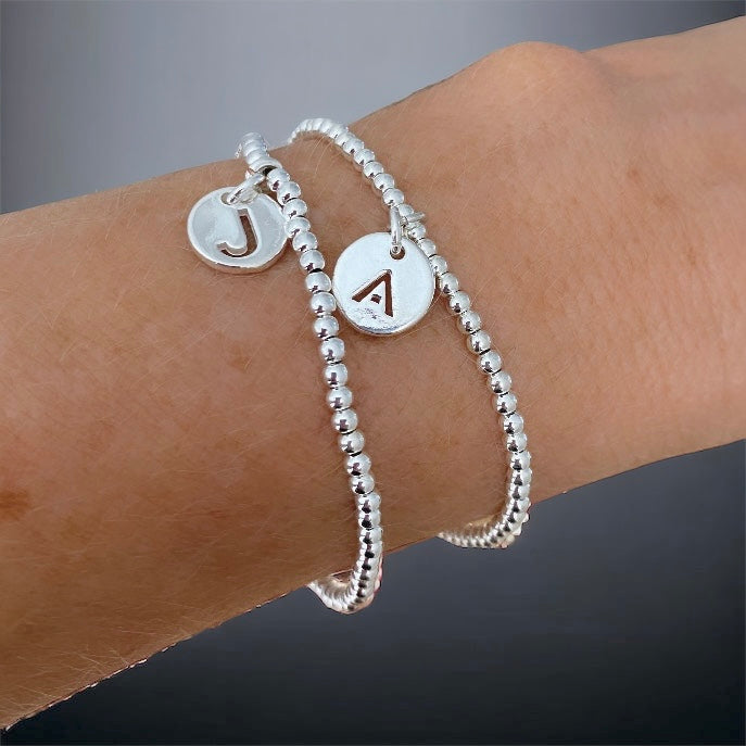 Pulsera letra plata