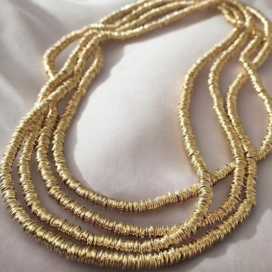 Collar mostacillas argollitas 125 cm. oro