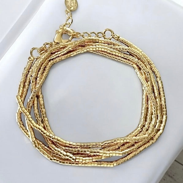 Pulsera mostacillas cinco vueltas oro