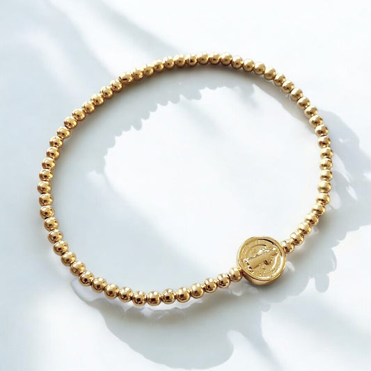 Pulsera bolitas medalla San Benito oro