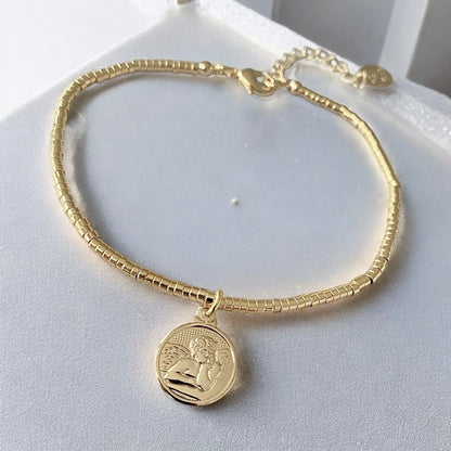 Pulsera mostacillas ángel de la guarda oro