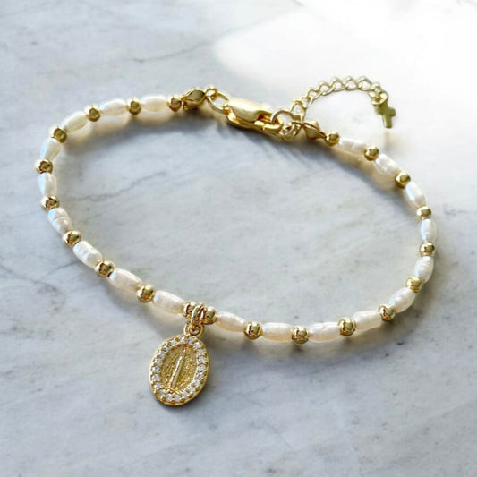 Pulsera perlas virgen oro