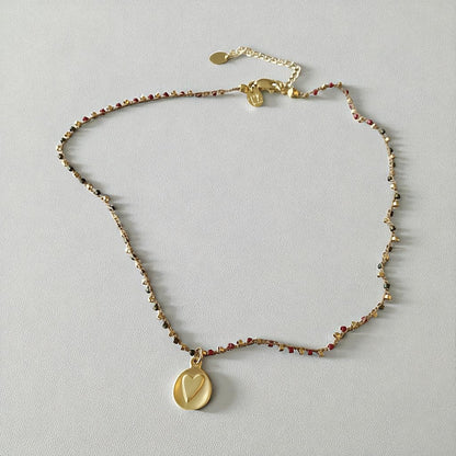 Collar tejido medalla corazón relieve oro