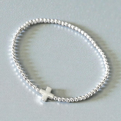 Pulsera bolitas cruz plata