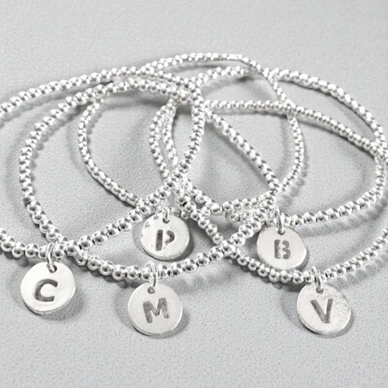 Pulsera letra plata