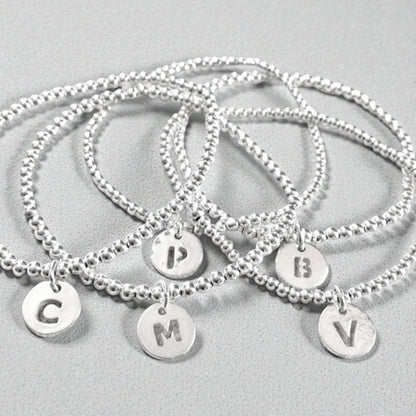 Pulsera letra plata