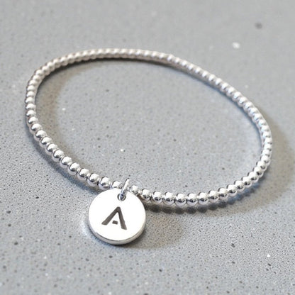 Pulsera letra plata