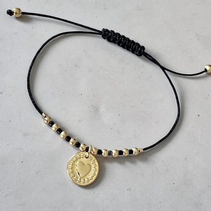 Pulsera hilo corazón relieve oro