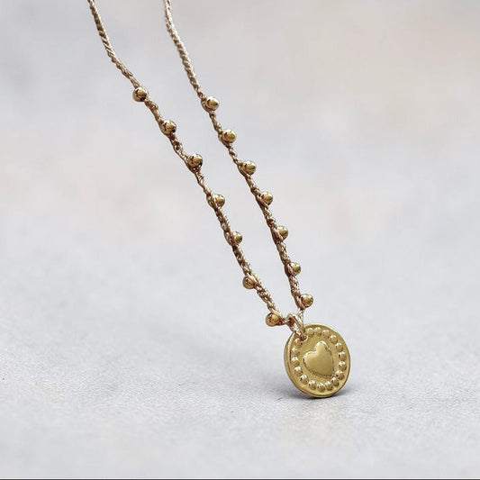 Collar tejido corazón relieve oro