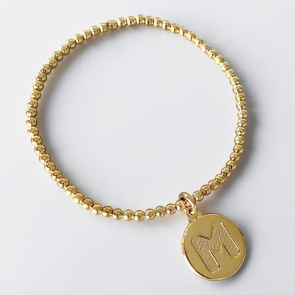 Pulsera medalla letra oro