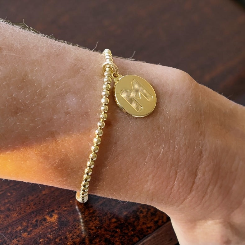 Pulsera medalla letra oro