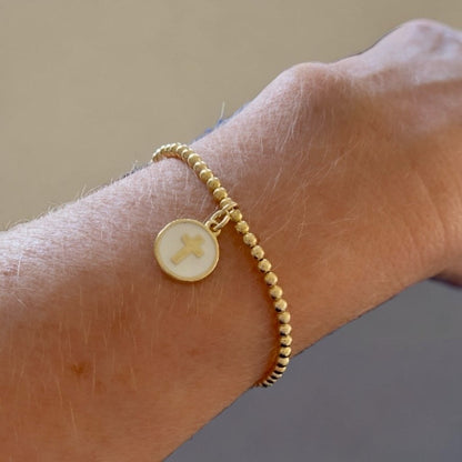 Pulsera bolitas medalla cruz oro
