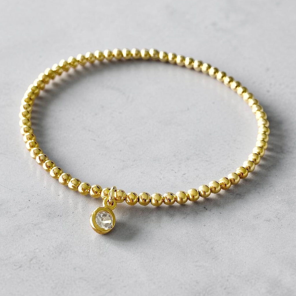 Pulsera bolitas punto de luz oro
