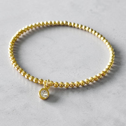 Pulsera bolitas punto de luz oro