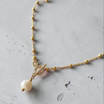 Collar bolitas perla broche oro