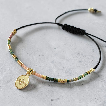 Pulsera hilo mijuki Espíritu Santo oro