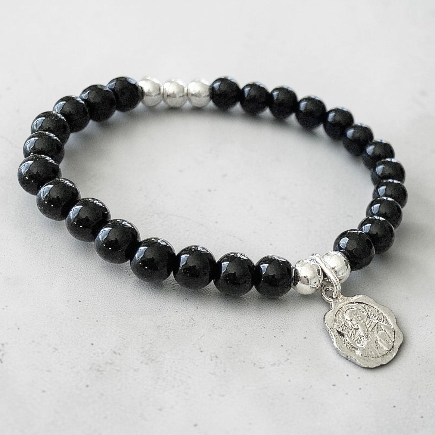 Pulsera ónix San Benito Abad plata