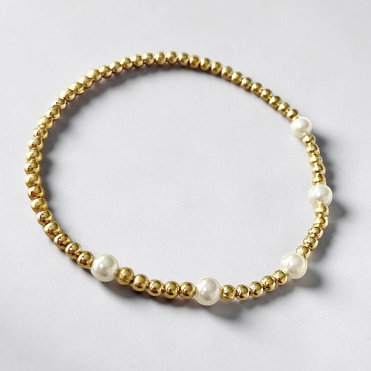 Pulsera cinco perlas oro