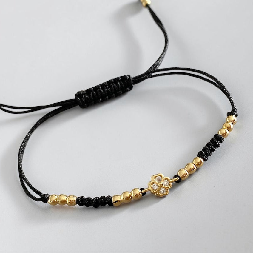 Pulsera hilo trébol oro