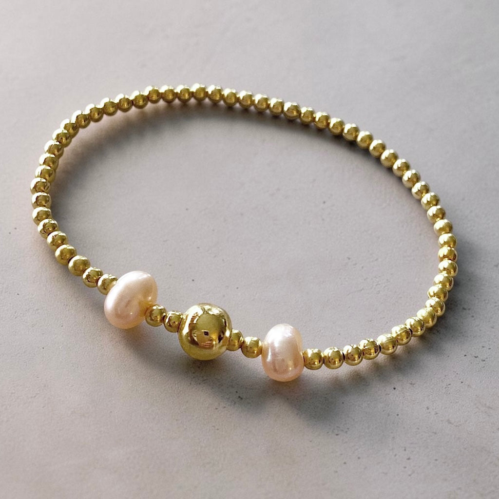 Pulsera dos perlas de río oro