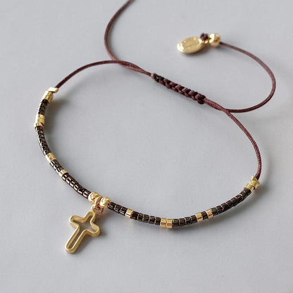 Pulsera hilo cruz oro